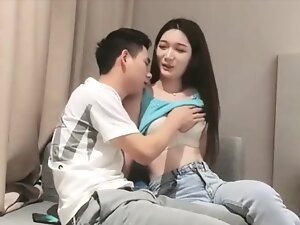 Asian girl engages in passionate, unfiltered sex for money in a steamy room.