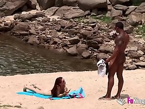 Monstrous cocked brunette gets a responsive blowjob at a nudist beach.