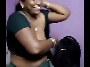 A shy Tamil aunt with a small chest seeks pleasure from a neighbor guy, leading to an erotic encounter.