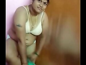 Desi aunty in Chennai moves out of her house, shedding clothes and indulging in sensual brushing. Hooter-slings and less duds.